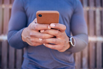 Communication, phone and closeup of hands typing a text message on social media or mobile app. Technology, online and man scroll or chatting on the internet for blog or website with a cellphone.