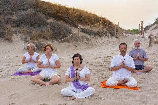Practicing yoga on the beach