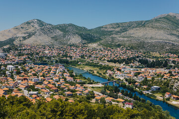 Fototapeta na wymiar Amazing view of Trebinje city from the hill in a sunny day. Travel destination in Bosnia and Herzegovina.