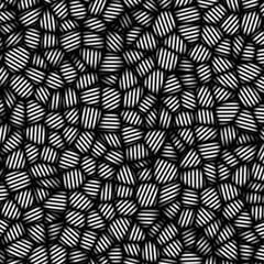 Seamless pattern of black and white circles on a black background