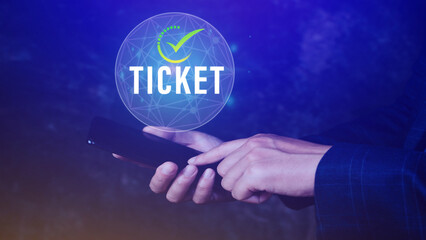 Businessman holding smartphone with button Ticket word, Business, Technology, internet and networking concept businessman pressing online booking button on virtual screens.