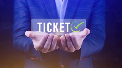 Businessman holding with button Ticket word, Business, Technology, internet and networking concept businessman pressing online booking button on virtual screens.