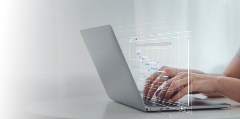Analyst working with computer in Business Analytics and Data Management System to make report with...