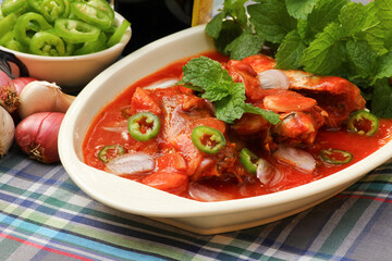 Spicy Sardines in tomato sauce canned fish .protein food on dish.