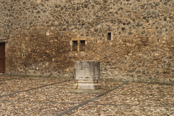 Fototapeta premium Old stone water well in Magnificent Norman castle Melfi Basilicata Italy