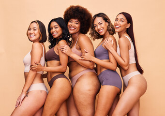 Body positive, diversity and portrait of women happy in studio for wellness, beauty and self love. Underwear campaign, natural and people on brown background for confidence, skincare and inclusion