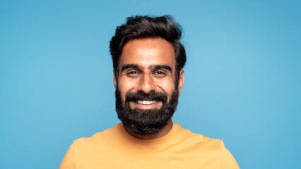 Closeup portrait of happy middle aged indian man in casual cheerfully smiling at camera, showing white teeth, panorama - obrazy, fototapety, plakaty
