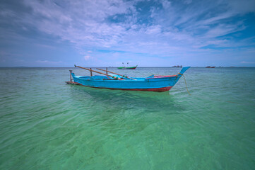 Fototapeta na wymiar Fishing boat in the sea at Bintan Island, Indonesia