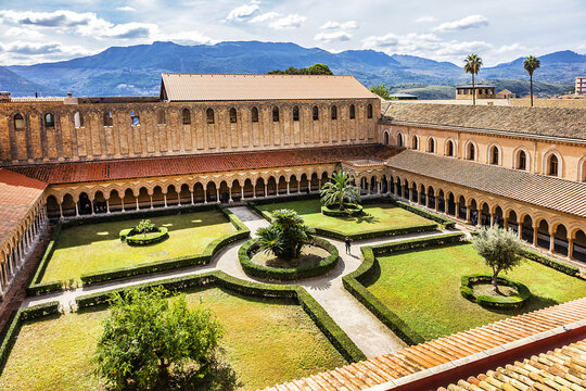 The famous Cloister of Roman Catholic Cathedral of Monreale (or Duomo di Monreale, 1267) near Palermo; one greatest extant examples of Norman architecture. Monreale, Sicily, Italy. September 28, 2018.