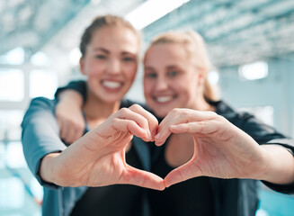 Happy woman, swimming and heart hands in care, support or teamwork in sport fitness together at...