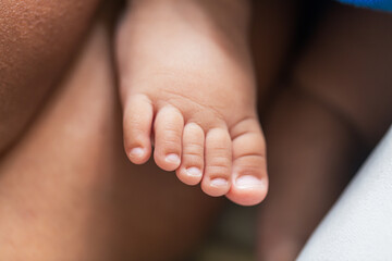 baby feet,Baby feet in hands, tiny newborn baby feet on hands, female close-up portrait, mother and her baby, happy family concept, beautiful conception image of childbirth.