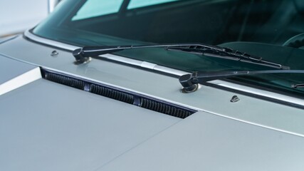 Windshield wipers on a silver car