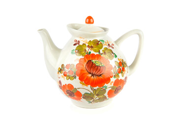 A big porcelain teapot with a bright ornament isolated on a white .