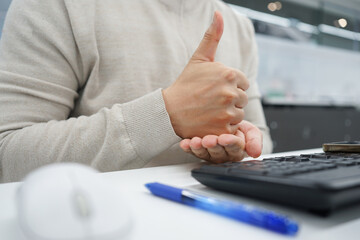 close up employee man hand gesture about stop sign language to teaching or assist colleagues from...