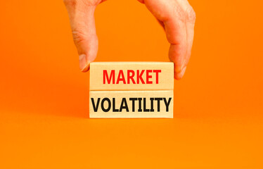 Market volatility symbol. Concept words Market volatility on beautiful wooden blocks. Beautiful...
