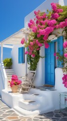 Fototapeta na wymiar Professional Shot of a Mediterranea House in Greece. Amazing Magenta Flowers creating this shot Captivating. 