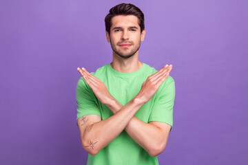Portrait of confident handsome guy with bristle wear green t-shirt hold arms crossed show stop...