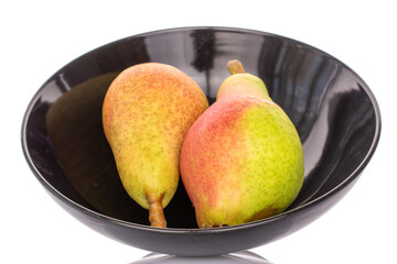 Two ripe pears in a ceramic plate, close-up, on a white background.