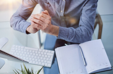 Young businessman in a meeting folded his hands