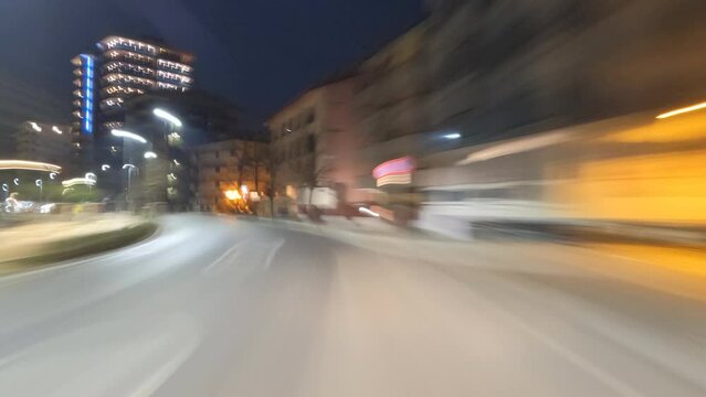 Night Lapse leaving center of town Grado in Italy 