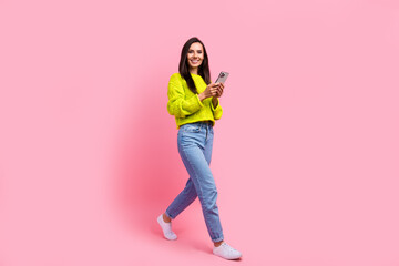 Photo of adorable positive cute lady wear denim stylish clothes walk street use gps navigation...