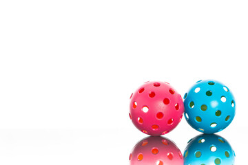 Couples Pickleball.  Pink and Blue Pickleball on a white background with lots of room for text.