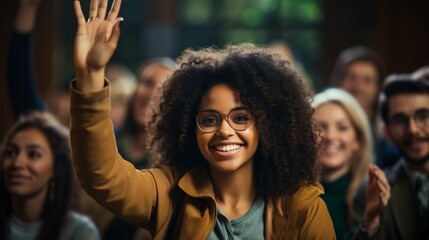 Happy African American student raising her hand to ask a question during lecture in the classroom