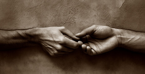 Fototapeta premium Two Hands Reaching and Touching