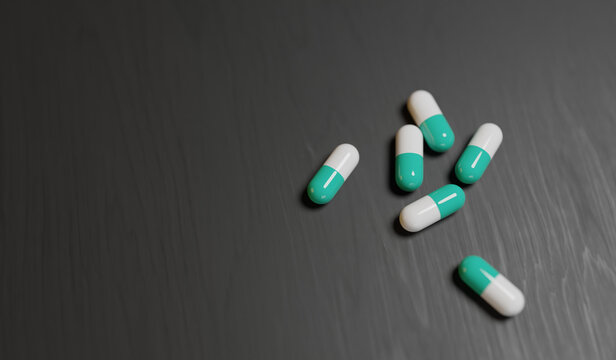 Pills on the table on a black background