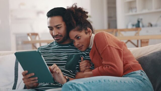 Couple, sofa and tablet for home internet, streaming service and watch video or social media. Young man and woman hug or relax on couch and digital technology, film or movie with website subscription