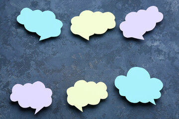 Blank speech bubbles on dark blue background