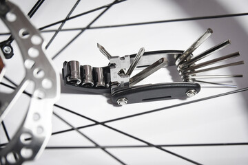 Multitool for bicycle tightening spokes and hexagons
