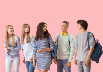 Group of students on pink background