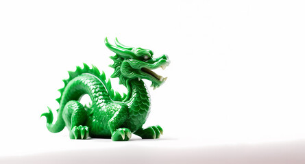 Fototapeta premium green, ceramic dragon on a white background, space for text, illustration, symbol of the new year 2024