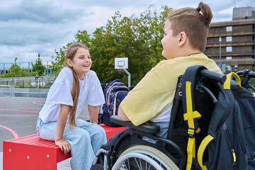 Friendship communication of children of boy in wheelchair and girl