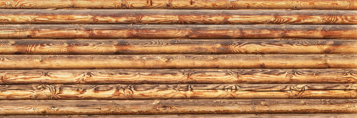 Wooden texture of the log house wall, background.