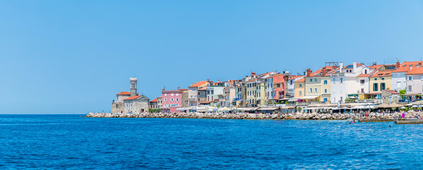 A view from the outer harbour along the promontory in the town of Piran, Slovenia in summertime