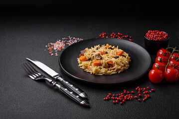 Delicious Uzbek pilaf with chicken, carrots, barberry, spices and herbs