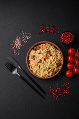 Delicious Uzbek pilaf with chicken, carrots, barberry, spices and herbs