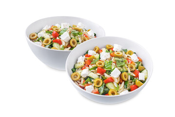 Spinach cucumber pepper orzo salad in a bowl on a white isolated background