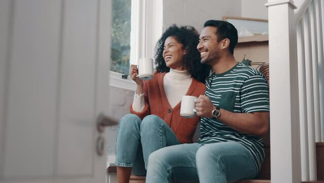 Happy couple, coffee and laughing in morning relax, funny joke or humor together and bonding on stairs at home. Man and woman drinking tea or beverage in happiness or satisfaction for holiday break