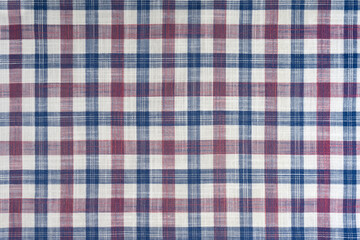 Blue and pink checkered texture fabric, tartan pattern. Shirt fabric, tablecloth textile, linen plaid cloth, classic scottish check pattern. Backdrop, wallpaper, background.