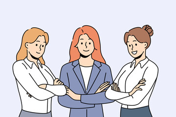 Successful business women stand with arms crossed and show confidence in professionalism. Three successful female office workers work as team and advise clients on management issues