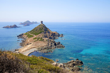 Fototapeta na wymiar Rocky Coastline. Sanguinaire islands and Parata Tower in Corsica, France.