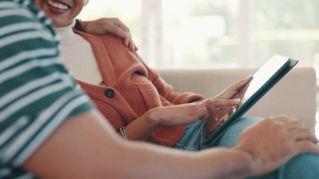 Happy couple on sofa with tablet, scroll social media meme or funny internet video in home together. Relax, man and woman on couch browsing, checking online post or joke on website with digital app.