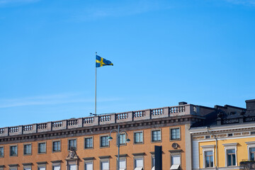 Fototapeta na wymiar The flag of Sweden on the building of the Embassy of Sweden in Helsinki.