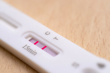 positive test for covid, antigenic test cassette, conducting rapid test covid-19 in medical laboratory, Laboratory Procedures and Medical Diagnostics viral disease © kittyfly