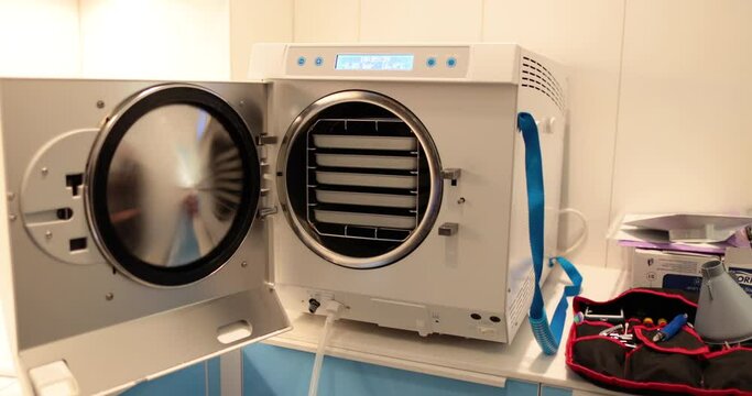Disinfection of dental instruments in an autoclave. The process of using an autoclave to disinfect medical instruments.