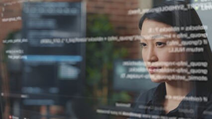 System administrator being helped by AR hologram to visualize script, writing code on computer screen while in office using programming language. Expert fixing errors during server maintenance