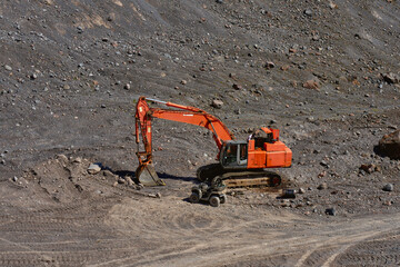 construction equipment works on the mountainside